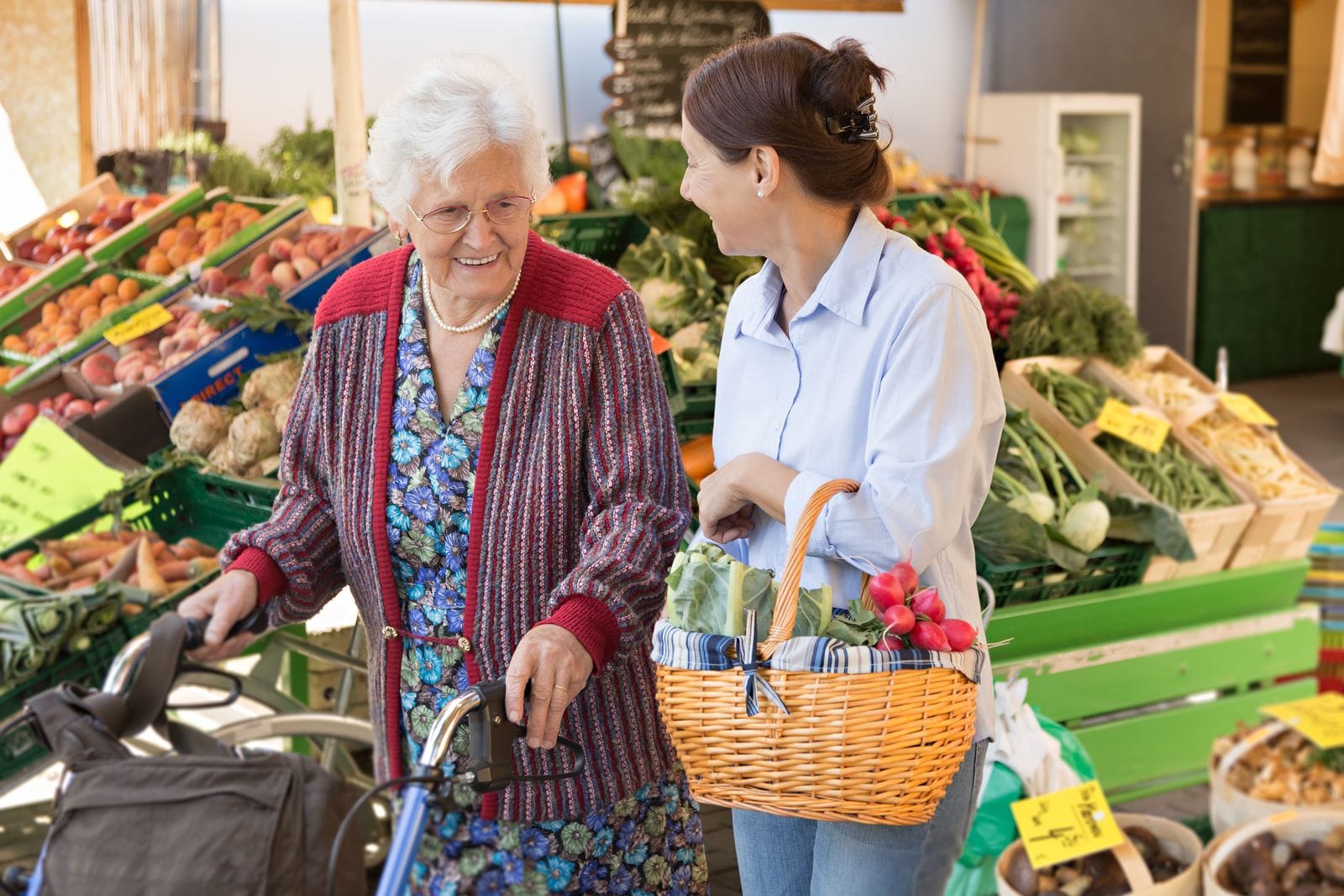 Caregiver helping senior client with payment options in Sarasota